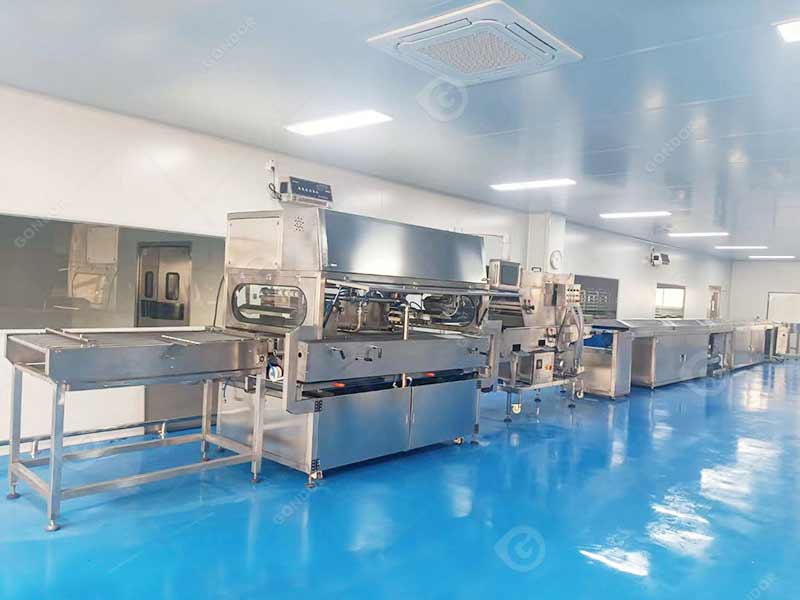 Industrial chocolate enrobing machine for mass production