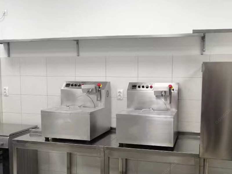 Compact tabletop chocolate enrober for small - batch production