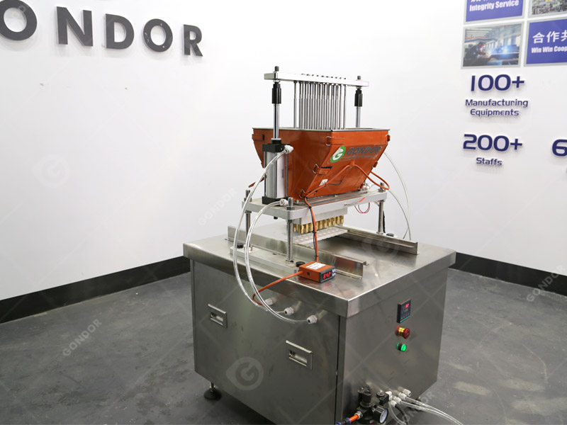 Machine à déposer des bonbons avec contrôle de la température pour une texture précise des bonbons